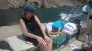 Merla laying in boat with Ang